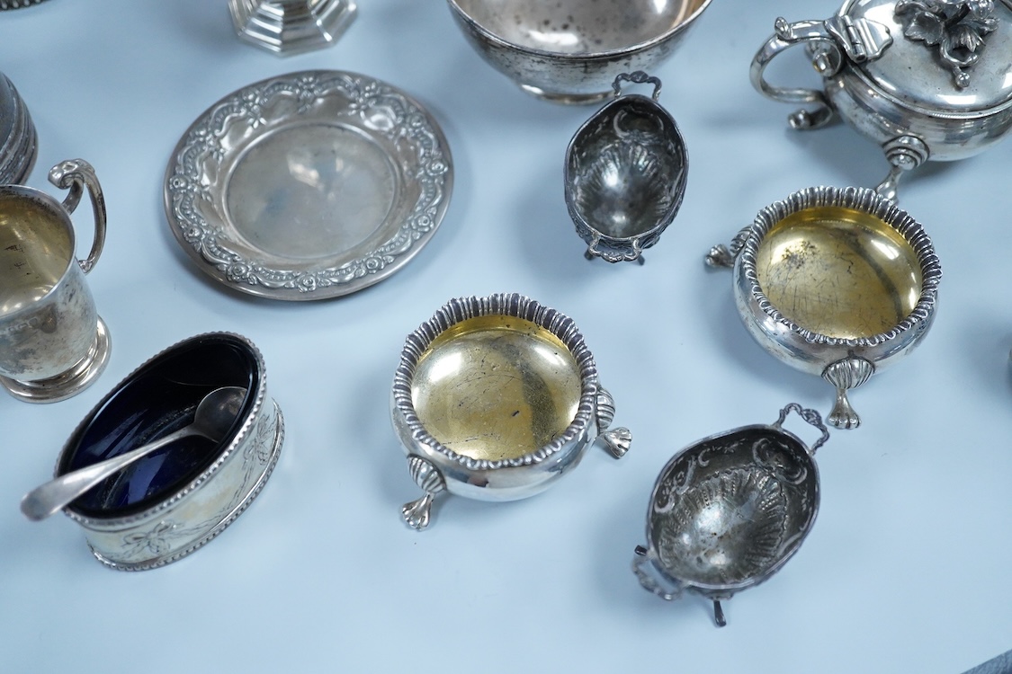 A collection of small silver wares to include a George V silver porringer, two George V silver sauce boats, a let Victorian silver sugar bowl, a George III silver goblet, with later embossed decoration, a George V small